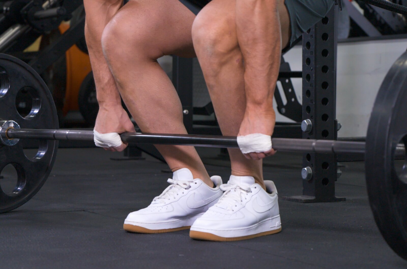 Weightlifter with taped wrists