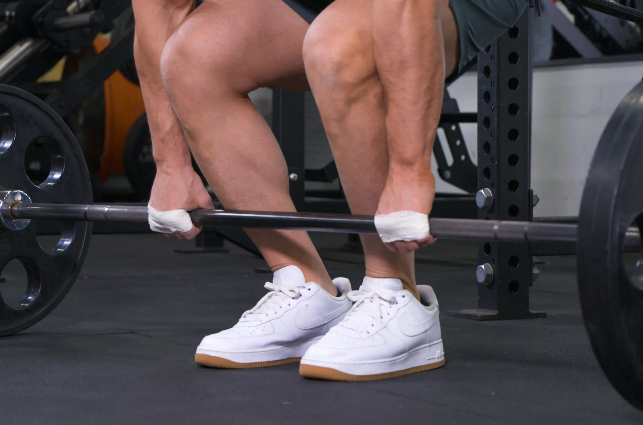 Weightlifter with taped wrists